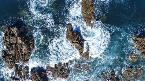 HD wallpaper: ocean waves hammering stone formation, aerial photography of ocean wave crashing ...