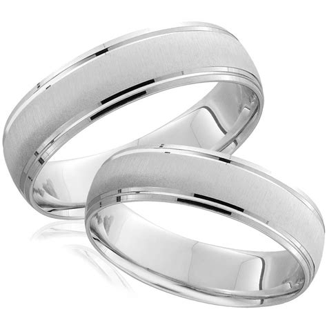 two white gold wedding bands with satin finish inlays, set on top of each other