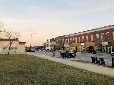 a city street with cars parked on the side of it