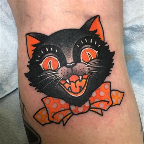 Halloween black cat tattoo | Cat face tattoos, Black cat tattoos, Halloween tattoos