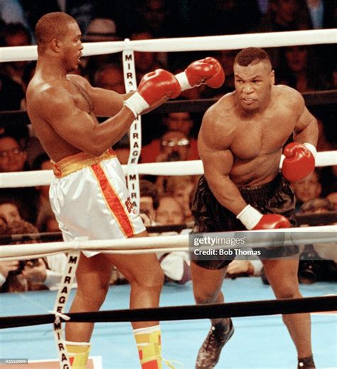 Mike Tyson and Donovan Razor Ruddock during their Heavyweight contest ...