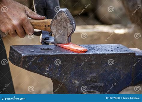 The Hand of a Blacksmith with a Hammer Stock Photo - Image of steel ...