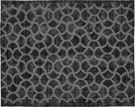 a black and white rug with circles on it