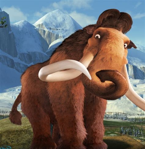the wooly mammoth is standing in front of some snowy mountains and snow - capped hills