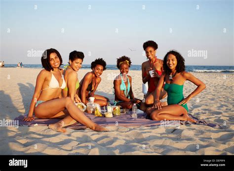 Woman relaxing beach african american hi-res stock photography and ...