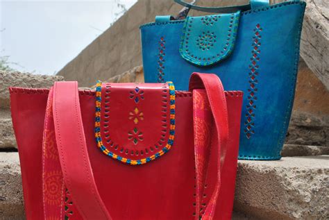 Vibrant bags made by leather artisans in Hodka village. The design was ...