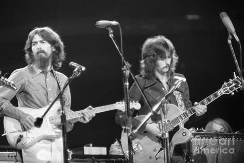 George Harrison And Eric Clapton by Bettmann