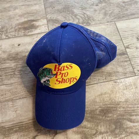 bass pro shops hat blue some fuzzies on it from... - Depop