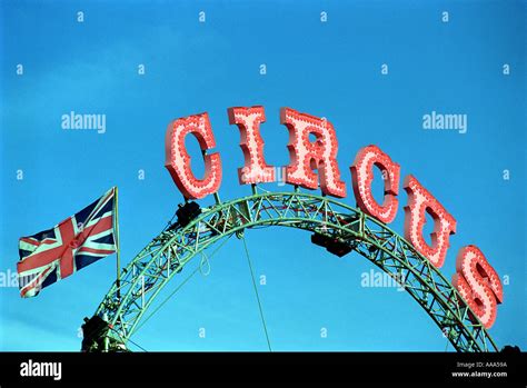 A circus sign and British Flag with blue sky Stock Photo - Alamy