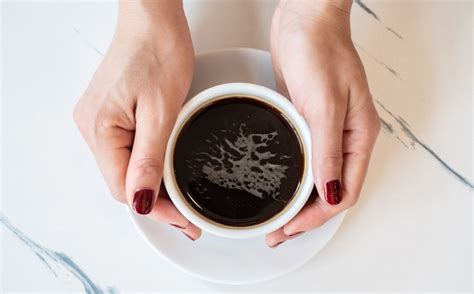 Someone,Hands,Holding,A,Cup,Of,Black,Coffee,Before,Drinking. | OSF HealthCare Blog