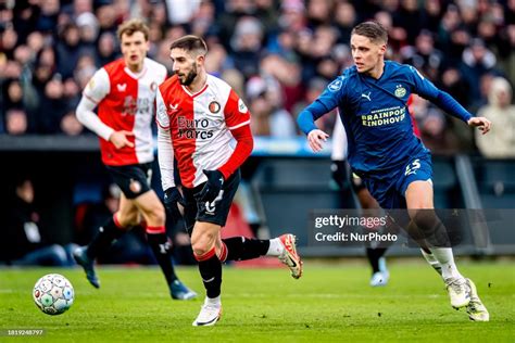 Feyenoord player Luka Ivanusec is playing against PSV player Joey ...