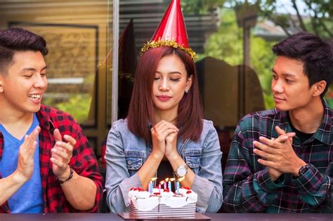 Premium Photo | Young woman make a wish on birthday party