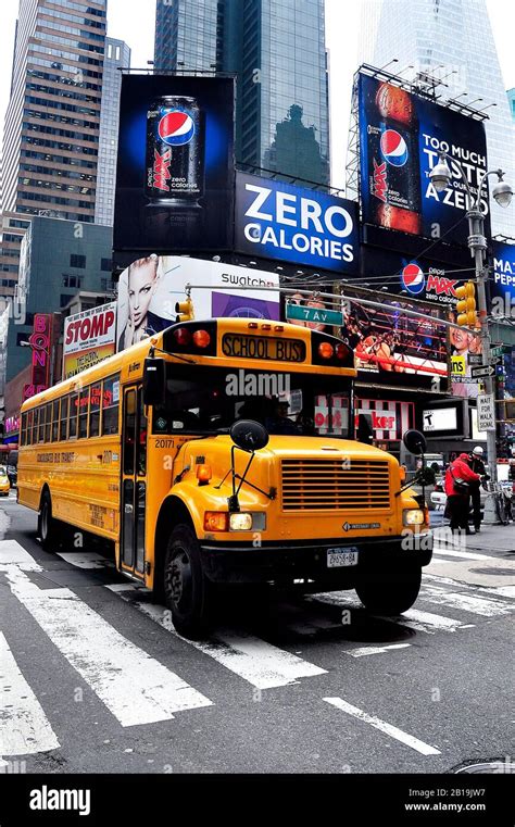 School bus over crossing in Times Square, Manhattan in New York City ...