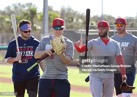 Boston Red Sox infielders Andrew Benintendi, left, Brock Holt, Dustin ...