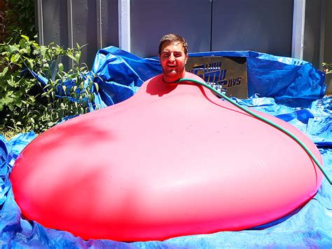 Watch a Guy Put Himself Inside a Giant Water Balloon (Spoiler Alert: It Explodes) - People
