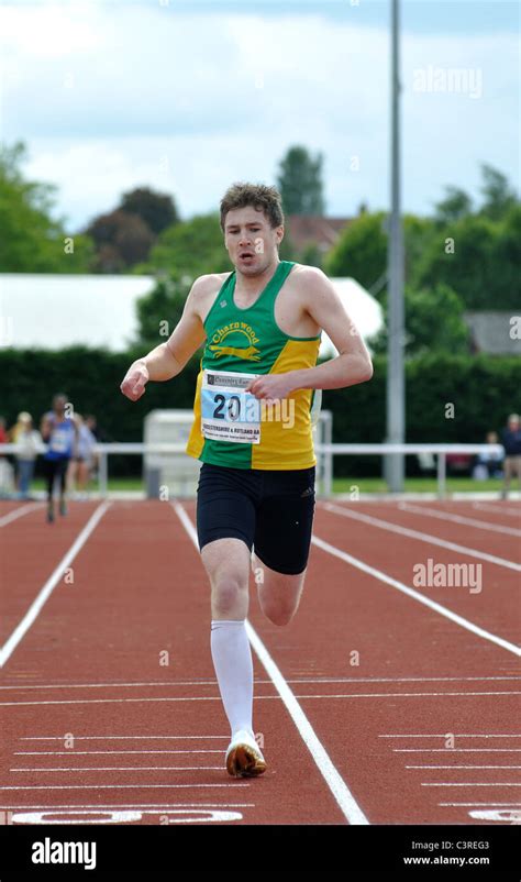 Runner finishing in men`s 400m race Stock Photo - Alamy