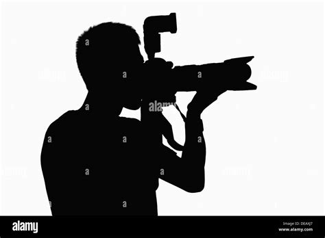 Silhouette of man holding camera Stock Photo: 60476703 - Alamy