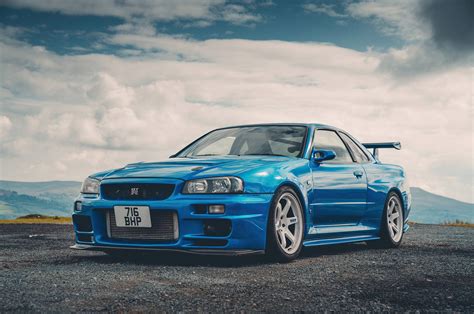 Download Turquoise Nissan Skyline Gtr R34 Wallpaper | Wallpapers.com