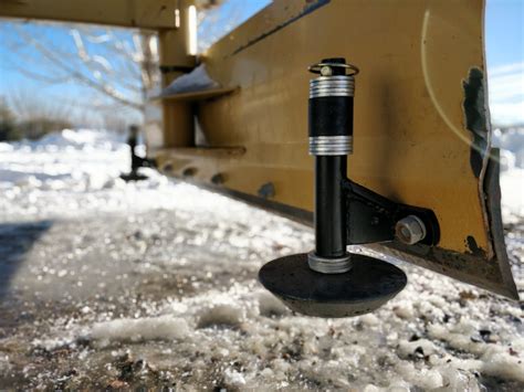 Skid shoes on a back blade for snow removal. - TractorByNet