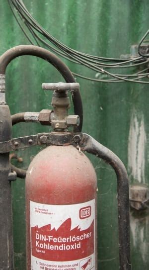 Fireman holding red and black water nozzle performing fire drill free image | Peakpx