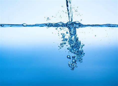 Water pouring into a body of water - StockFreedom - Premium Stock Photography