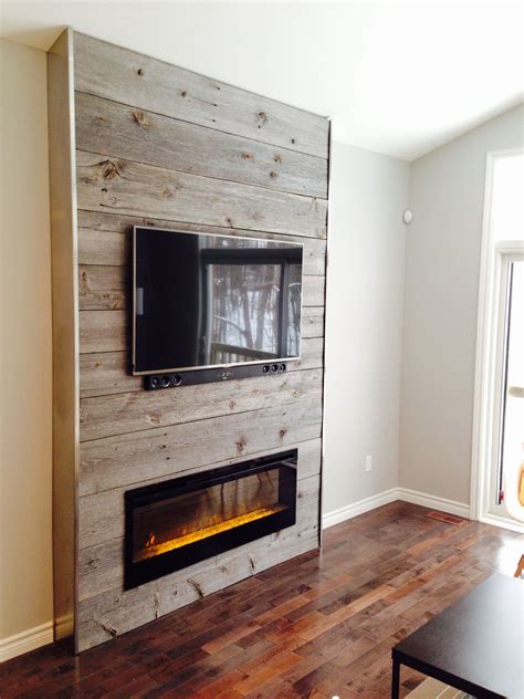 Fireplace feature wall completed with grey reclaimed barn board supplied by barnboardstore ...