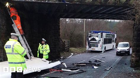 Double decker bus roof ripped off in Fauldhouse bridge crash - BBC News