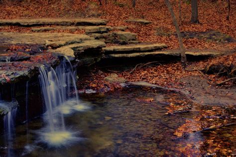 Waterfall in Autumn - Platte River State Park Photograph by Nikolyn McDonald