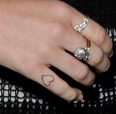 Miley Cyrus Heart Tattoo on her Finger - Meaning and Story Behind It