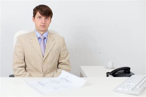 Serious Man in a Business Suit at Work in Office Stock Image - Image of face, serious: 12865295