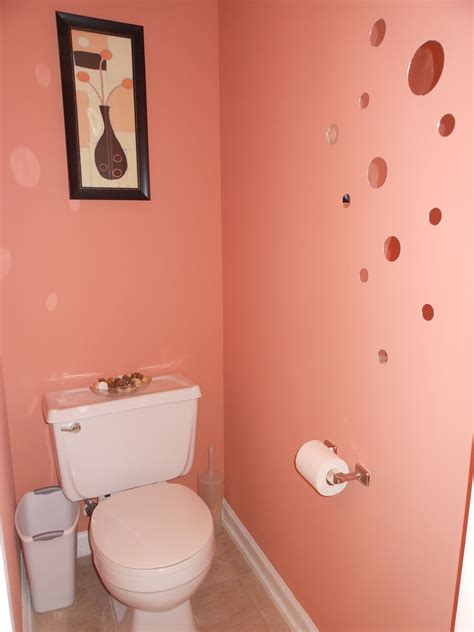 Half bath on the first floor. Repainted, stick-on mirror circles. Coral Island from Sherwin ...
