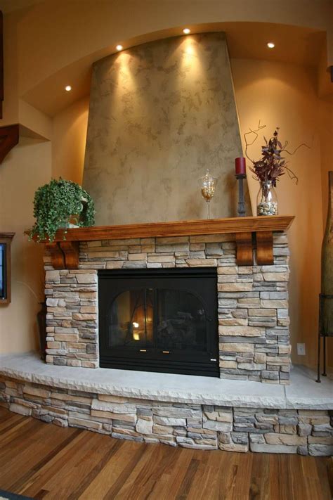 Sweeping Curves Create Warm Alcove | Home fireplace, Fireplace design, Rock fireplaces