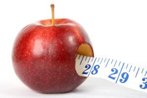 Red Apple and Tape Measure Dieting Concept