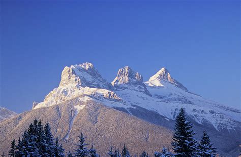 Three Sisters Mountains, Canmore by John E Marriott