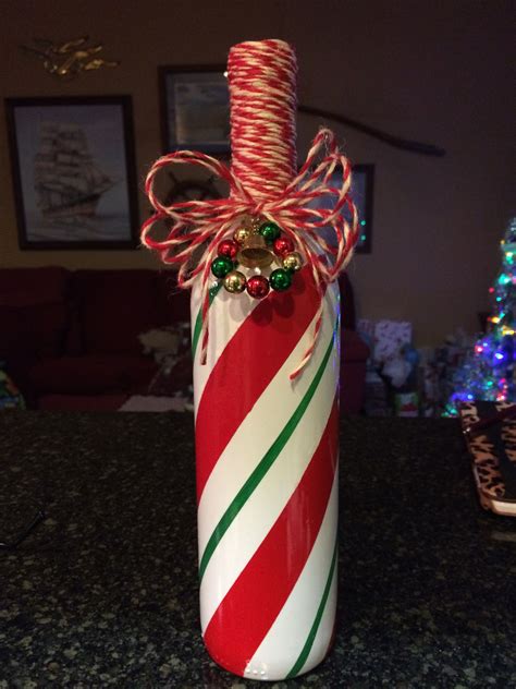 Christmas candy cane painted bottle crafts | Wine bottle crafts christmas, Christmas wine bottle ...