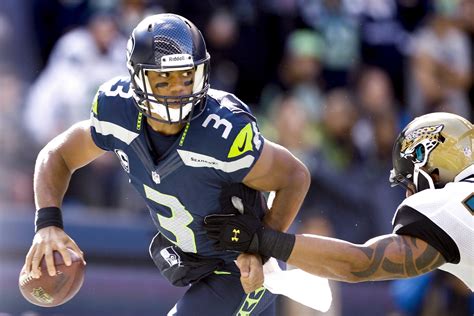 Russell Wilson is the third-highest paid quarterback on the Seattle ...