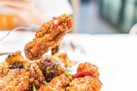 Premium Photo | Fried chicken with spicy sauce