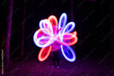 Abstract neon shapes made with LED poi Stock Photo | Adobe Stock