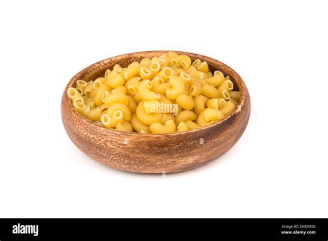 PIle of yellow dried elbow macaroni pasta shapes Stock Photo - Alamy