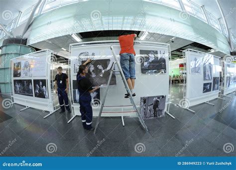 Workers Set Stands Using a Trestle Ladder in the Boryspil Airport ...