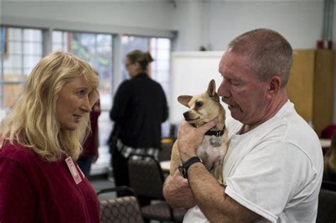 Clallam Bay inmates reunite with reformed dogs