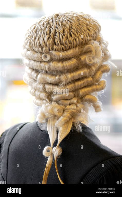 British judge with wig standing and thinking in high court London UK ...