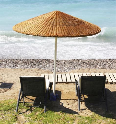 Beach chairs and umbrella stock image. Image of sunny - 21741479