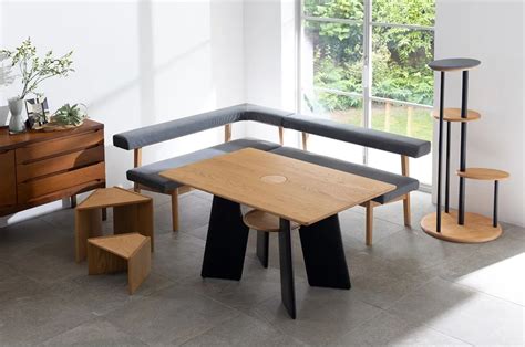 This cat-centered table design features a cavity and hidden shelf for ...