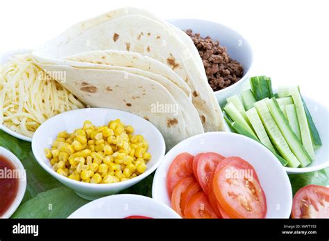 A layout of taco ingredients isolated on white Stock Photo - Alamy