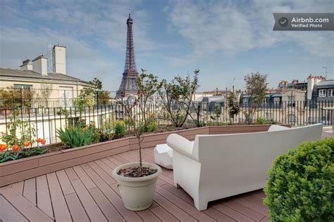 Eiffel tower, Luxury flat à Paris... yeah, I wouldn't mind sitting on that couch with a glass of ...