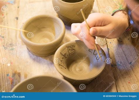 Clay works stock photo. Image of artisan, bowl, finger - 60384504