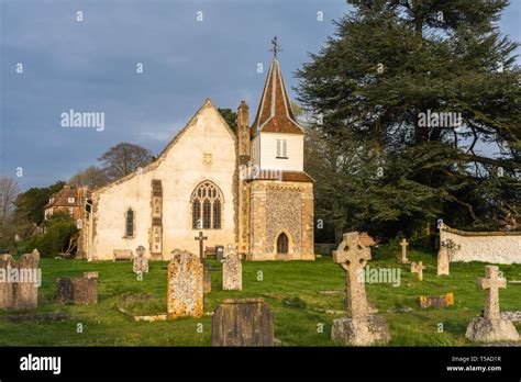 12th century St Mary the Less Church and graveyard in the village of ...