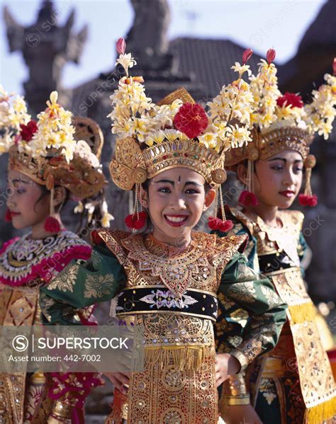 Three Legong dancers dressed in traditional costumes, Bali, Indonesia ...