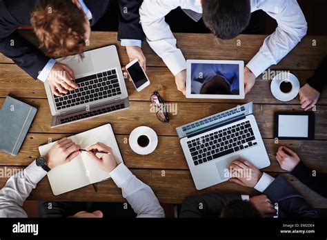 Group of business people using modern gadgets at workplace Stock Photo - Alamy